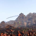 Best Medieval games - An army in red is laying siege to a village in Mount and Blade 2: Bannerlord.