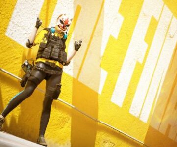 The Finals crossplay: a person wearing a mash, and tactical military gear thands in front of a yellow wall.