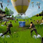 Fortnite tips: lots of loopers are running towards a crate that dropped into a field via a balloon.