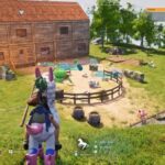 Palworld review: The Pal Tamer sits astride a mount overlooking the rudimentary base, including a large wooden shack and a pastoral ranch.