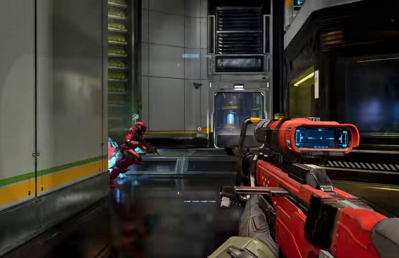 The player is holding a red sniper rifle, one of the best Halo Infinite weapons, as a red Spartan dashes around a corner.