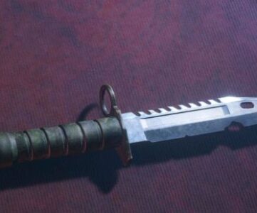 Resident Evil 4 best weapons: The Combat Knife lying on the counter of the Merchant's shop stall.