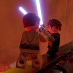 Best Star Wars games on PC: two LEGO figures fight with laser swords