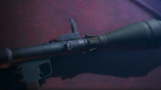 Resident Evil 4 best weapons: The Rocket Launcher lying on the counter of the Merchant's shop stall.